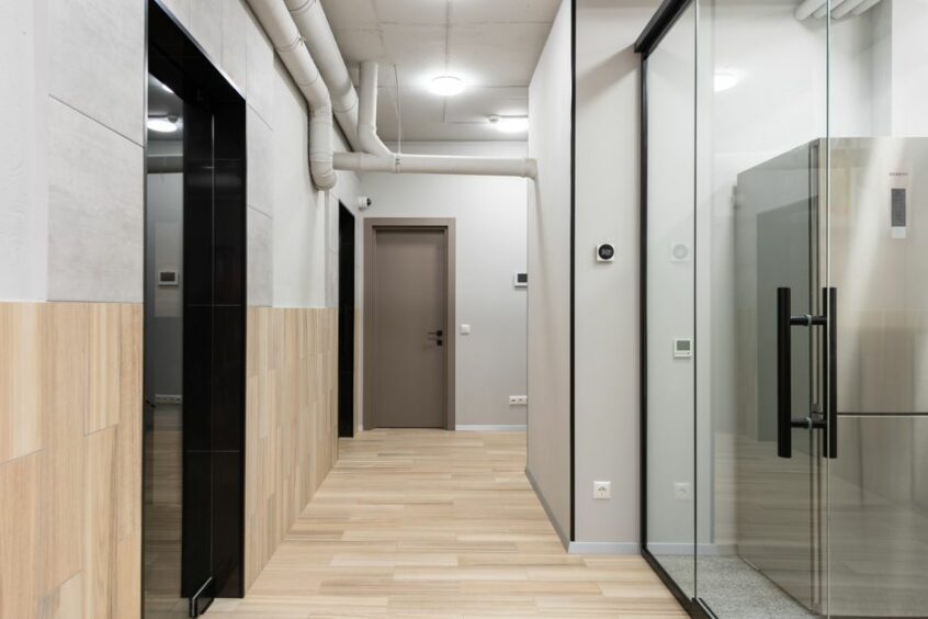 Commercial laminate flooring in a modern office showing durability and aesthetic appeal